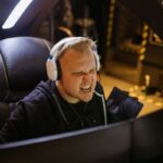 Gamer grimacing at computer screen